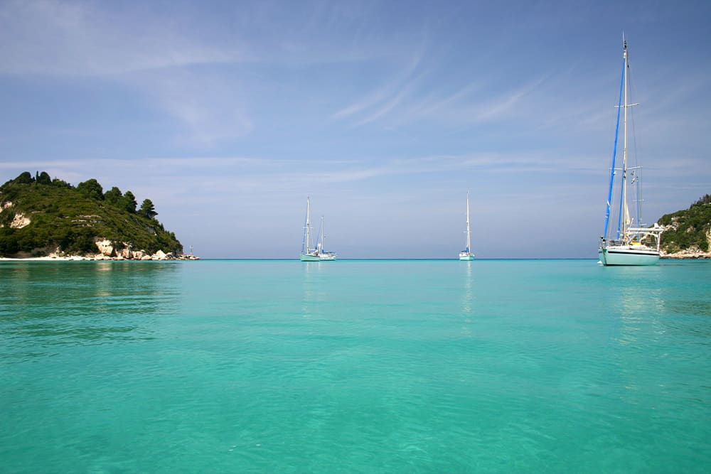 Lakka harbour with crystal clear water